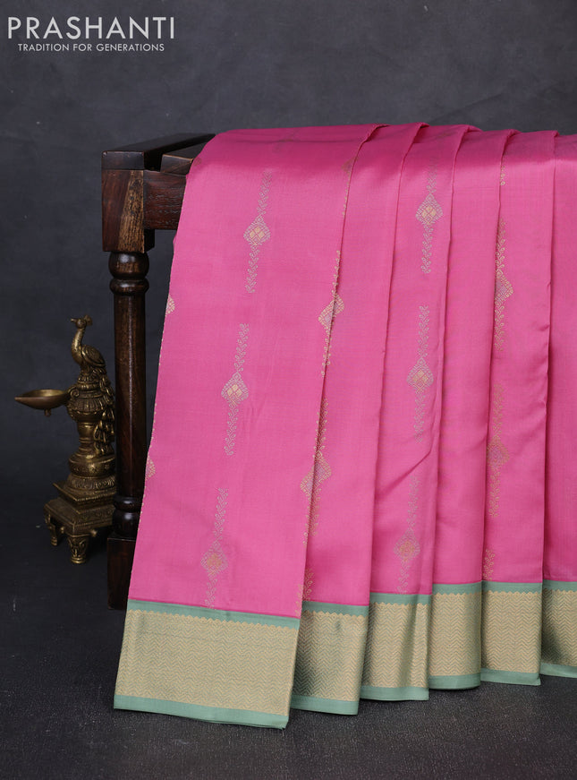Pure kanchipuram silk saree peach pink and pastel green with allover silver& zari woven buttas and zari woven korvai border