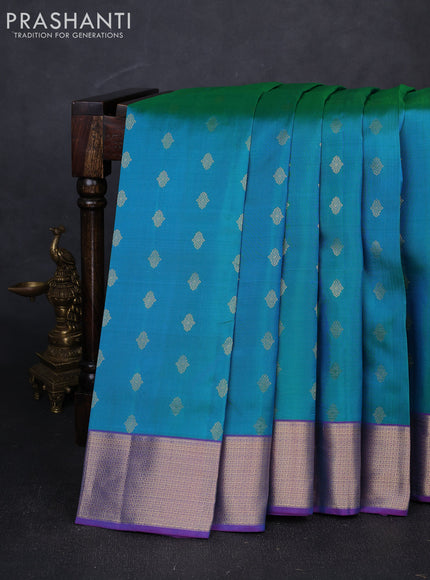 Pure kanchipuram silk saree dual shade of teal green and purple with allover zari woven buttas and zari woven border
