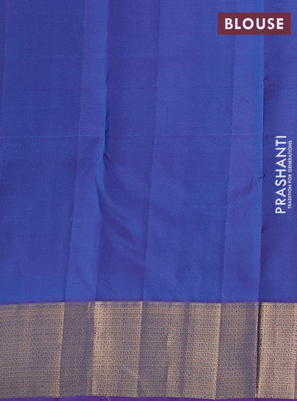 Pure kanchipuram silk saree dual shade of teal green and purple with allover zari woven buttas and zari woven border