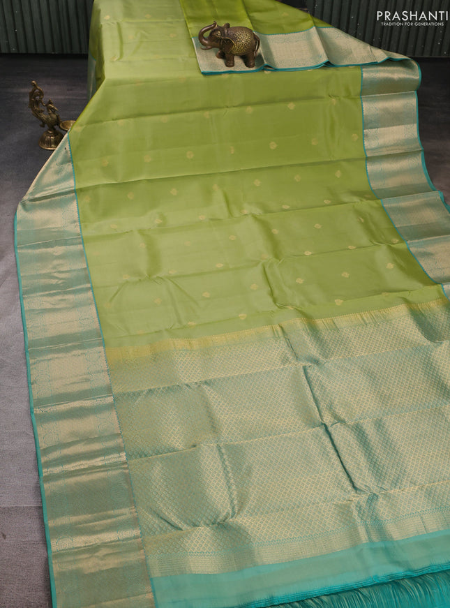 Pure kanchipuram silk saree pista green and teal green with allover zari woven buttas and long zari woven border