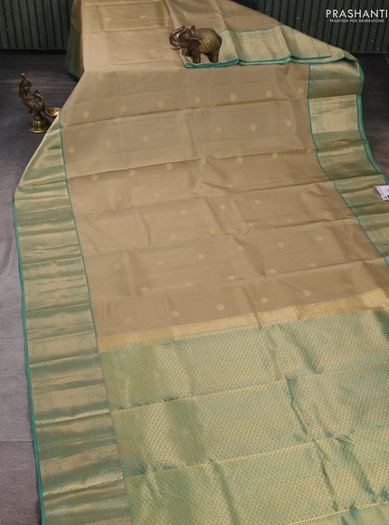 Pure kanchipuram silk saree pastel green and teal green with allover zari woven buttas and zari woven border