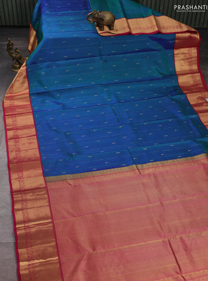 Pure kanchipuram silk saree dual shade of greenish blue and pink with allover zari woven buttas and zari woven border
