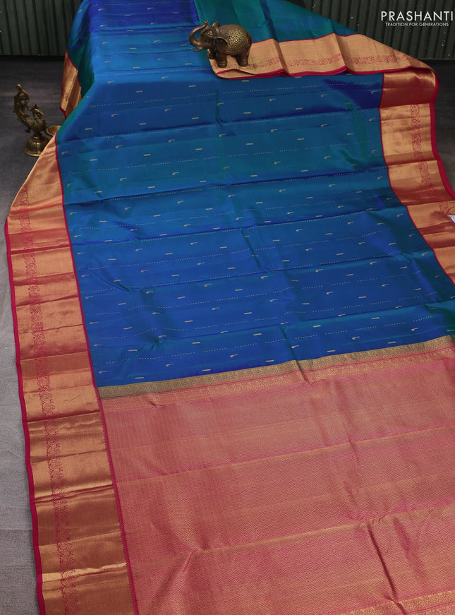 Pure kanchipuram silk saree dual shade of greenish blue and pink with allover zari woven buttas and zari woven border