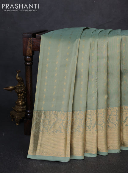 Pure kanchipuram silk saree pastel green with allover zari woven buttas and long zari woven border