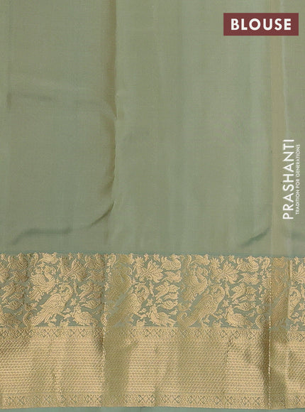 Pure kanchipuram silk saree pastel green with allover zari woven buttas and long zari woven border