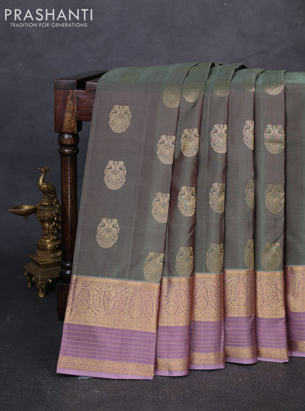 Pure kanchipuram silk saree pastel green and pastel purple with allover zari woven buttas and long zari woven border
