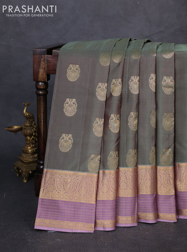 Pure kanchipuram silk saree pastel green and pastel purple with allover zari woven buttas and long zari woven border