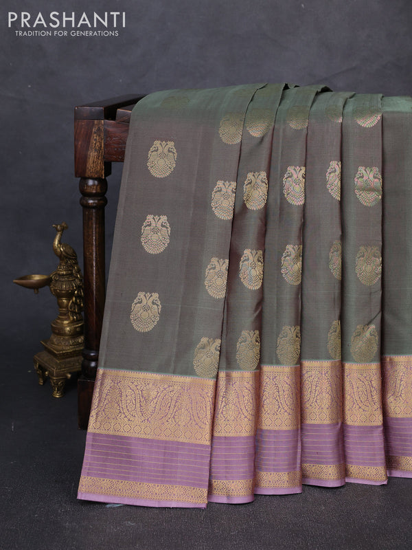 Pure kanchipuram silk saree pastel green and pastel purple with allover zari woven buttas and long zari woven border