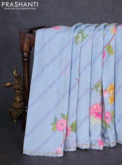 Crepe silk saree pastel blue with allover prints and sequin pallu