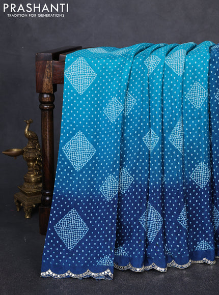 Crepe silk saree indigo blue with allover bandhani prints and mirror embroidery pallu