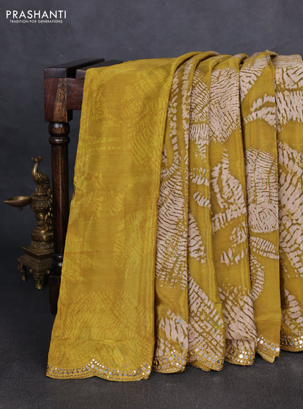 Crepe silk saree mustard green with allover tie & dye prints and mirror embroidery pallu