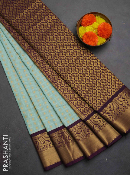 Semi kanchipuram silk saree light blue and deep purple with allover checks & zari woven buttas and zari woven korvai border