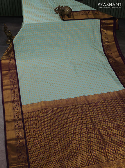 Semi kanchipuram silk saree light blue and deep purple with allover checks & zari woven buttas and zari woven korvai border