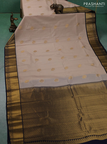 Semi kanchipuram silk saree beige and navy blue with zari woven buttas and zari woven korvai border