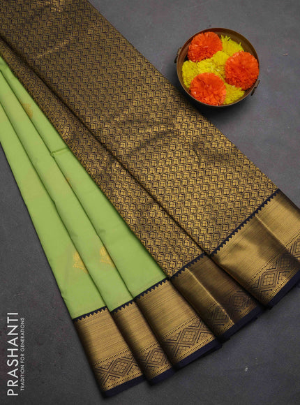 Semi kanchipuram silk saree pista green and navy blue with zari woven buttas and zari woven korvai border