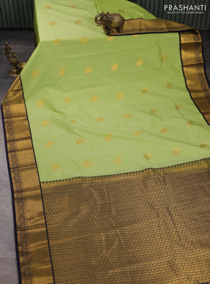 Semi kanchipuram silk saree pista green and navy blue with zari woven buttas and zari woven korvai border