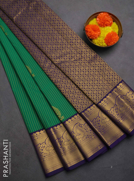 Semi kanchipuram silk saree green and blue with allover zari weaves & buttas and peacock zari woven korvai border