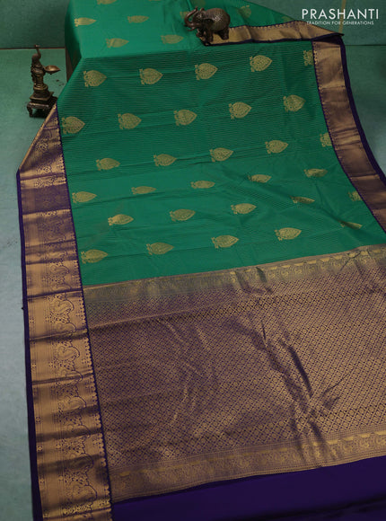 Semi kanchipuram silk saree green and blue with allover zari weaves & buttas and peacock zari woven korvai border