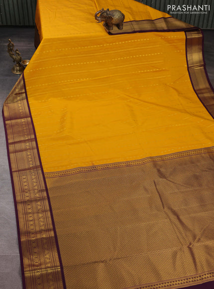 Semi kanchipuram silk saree mango yellow and wine shade with allover zari weaves & buttas and zari woven korvai border