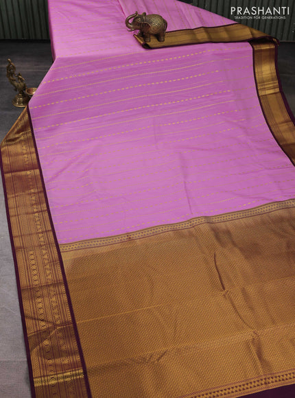 Semi kanchipuram silk saree lavender and deep purple with allover zari weaves & buttas and zari woven korvai border
