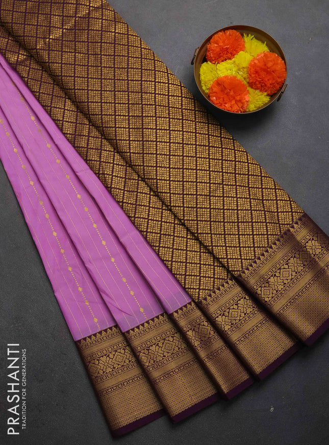 Semi kanchipuram silk saree lavender and wine shade with allover zari weaves and zari woven korvai border