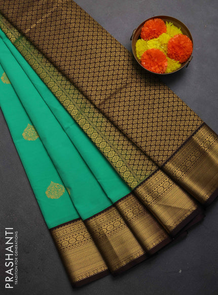 Semi kanchipuram silk saree teal green and coffee brown with zari woven buttas and zari woven korvai border
