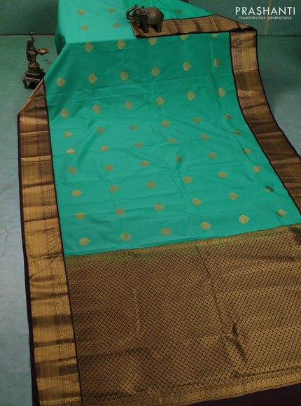 Semi kanchipuram silk saree teal green and coffee brown with zari woven buttas and zari woven korvai border