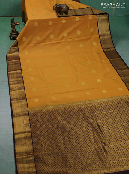 Semi kanchipuram silk saree mustard yellow and coffee brown with zari woven buttas and zari woven korvai border