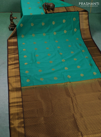 Semi kanchipuram silk saree teal green and coffee brown with allover zari woven buttas and zari woven border