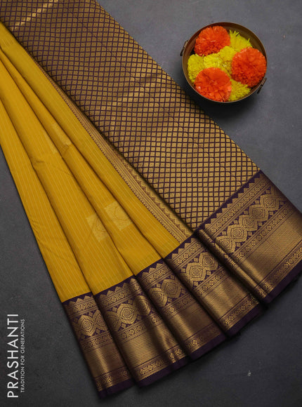 Semi kanchipuram silk saree mustard yellow and deep purple with allover zari weaves & buttas and zari woven border