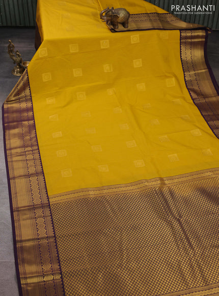 Semi kanchipuram silk saree mustard yellow and deep purple with allover zari weaves & buttas and zari woven border