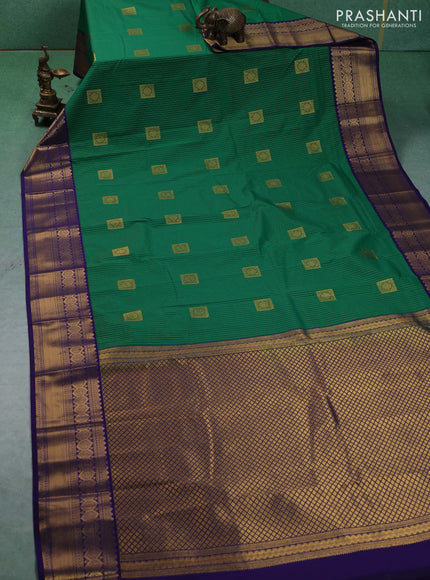 Semi kanchipuram silk saree green and blue with allover zari weaves & buttas and zari woven border