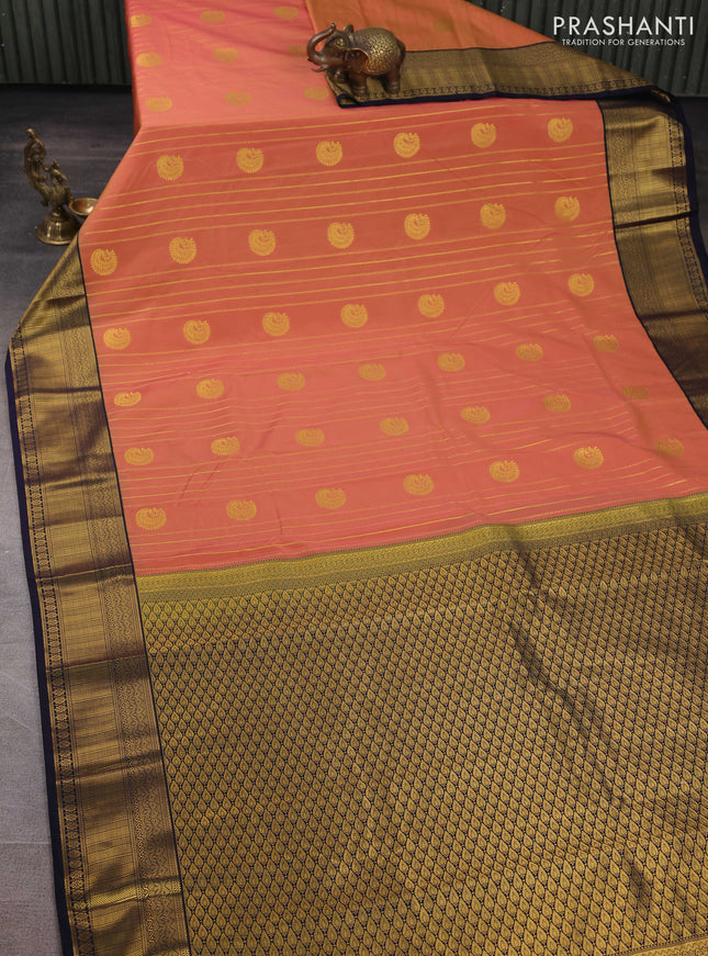 Semi kanchipuram silk saree dual shade of yellowish pink and navy blue with allover zari weaves & buttas and zari woven border