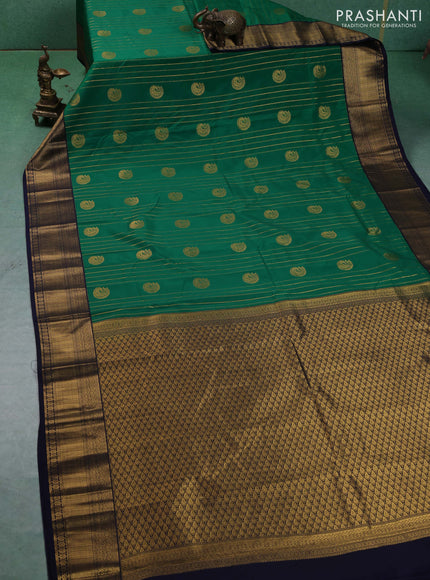 Semi kanchipuram silk saree green and navy blue with allover zari weaves & buttas and zari woven border