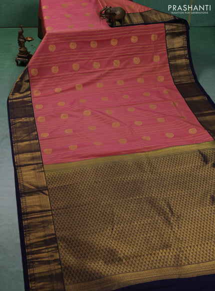 Semi kanchipuram silk saree dual shade of yellowish pink and navy blue with allover zari weaves & buttas and zari woven border
