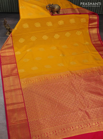 Semi kanchipuram silk saree mustard yellow and pink with allover zari weaves & buttas and zari woven border