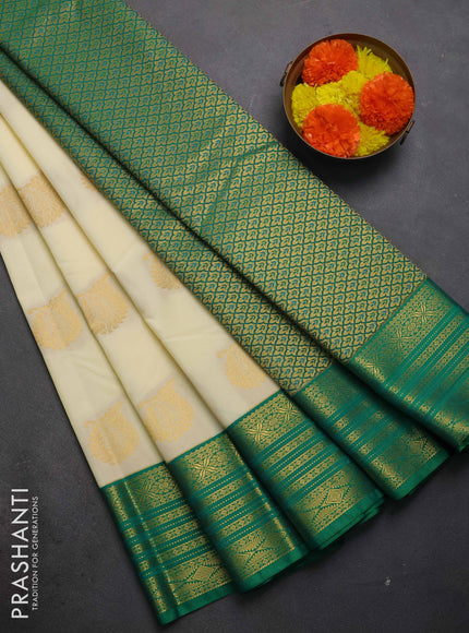 Semi kanchipuram silk saree cream and green with zari woven buttas and zari woven border