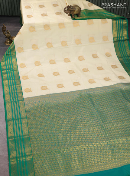 Semi kanchipuram silk saree cream and green with zari woven buttas and zari woven border