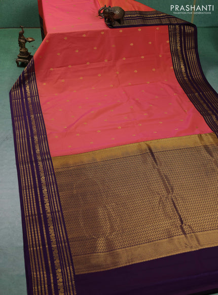 Semi kanchipuram silk saree dual shade of pinkish yellow and purple with zari woven buttas and long zari woven korvai border