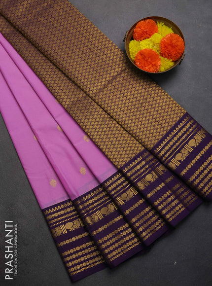 Semi kanchipuram silk saree lavender and violet with zari woven buttas and long zari woven korvai border