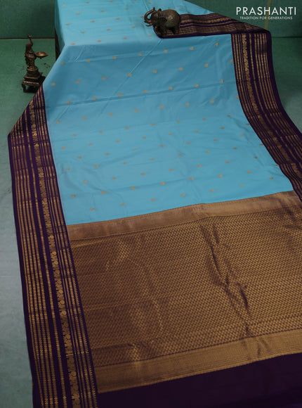 Semi kanchipuram silk saree teal blue and purple with zari woven buttas and long zari woven korvai border