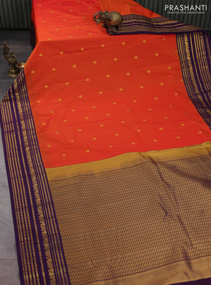 Semi kanchipuram silk saree orange and purple with zari woven buttas and long zari woven korvai border