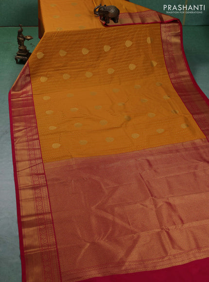 Semi kanchipuram silk saree mustard yellow and pink with allover zari woven 1000 buttas and zari woven border