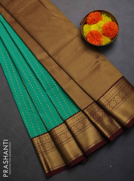 Semi kanchipuram silk saree teal green and deep maroon with allover zari woven 1000 buttas and zari woven border