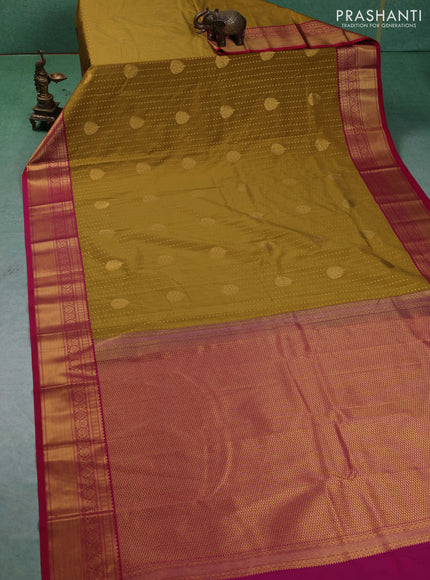 Semi kanchipuram silk saree mustard green and pink with allover zari woven 1000 buttas and zari woven border