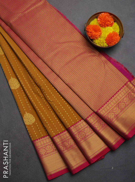 Semi kanchipuram silk saree dark mustard and pink with allover zari woven 1000 buttas and zari woven border