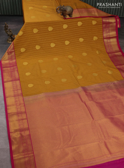 Semi kanchipuram silk saree dark mustard and pink with allover zari woven 1000 buttas and zari woven border