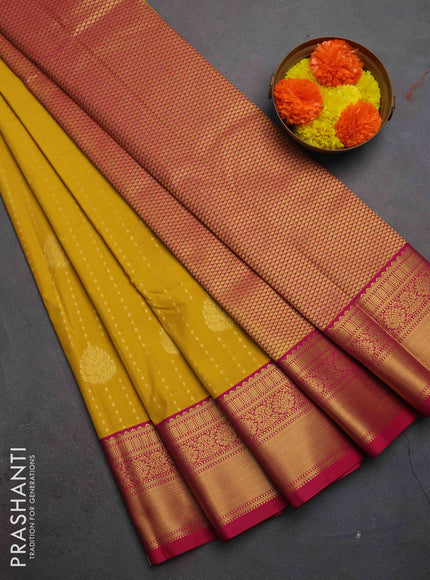 Semi kanchipuram silk saree mustard yellow and pink with allover zari woven 1000 buttas and zari woven border