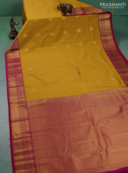 Semi kanchipuram silk saree mustard yellow and pink with allover zari woven 1000 buttas and zari woven border