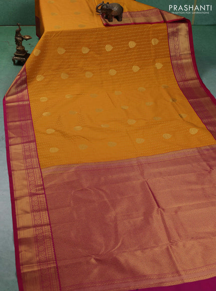 Semi kanchipuram silk saree mustard yellow and pink with allover zari woven 1000 buttas and zari woven border